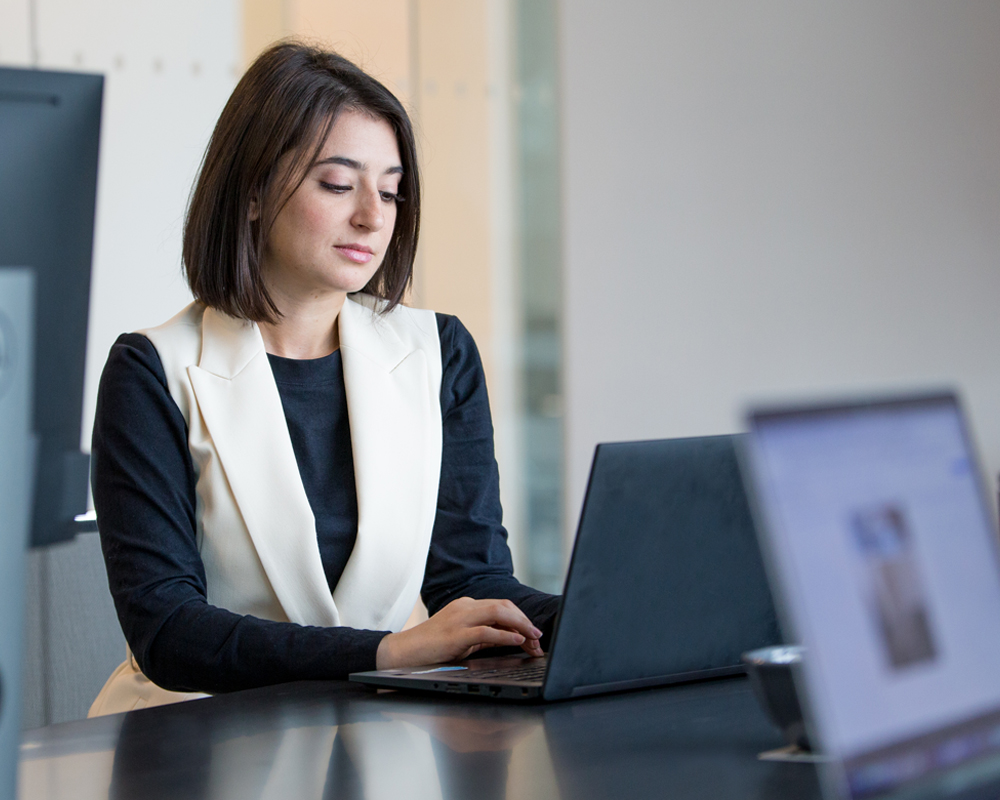 Salesforce CRM team member on Laptop