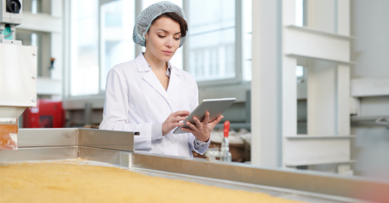 girl with tablet and infor m3 erp in a food industry